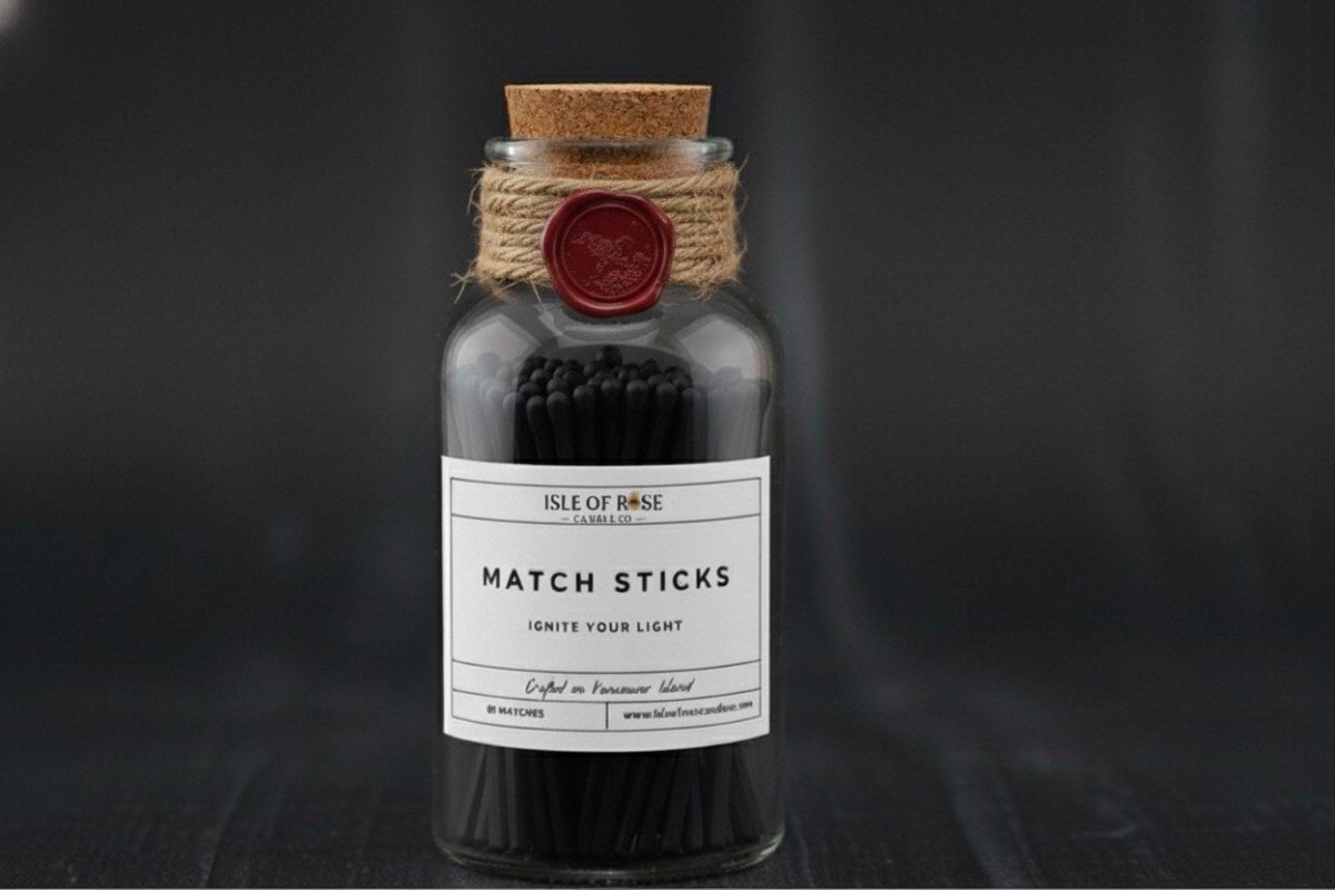 Bottle of matchsticks with a cork lid and label on a dark background