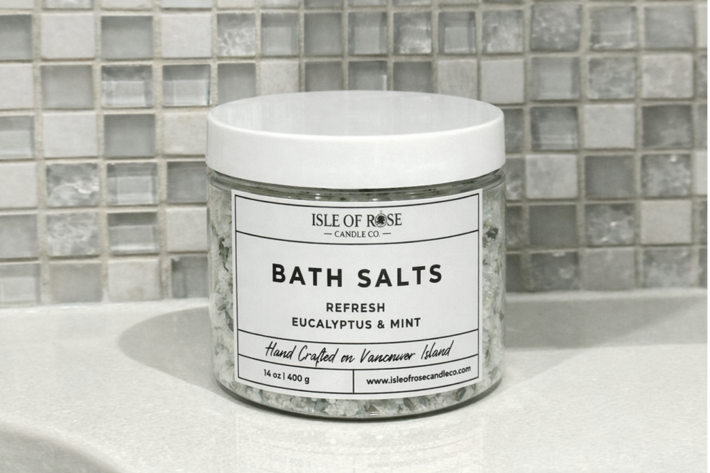 Jar of Isle of Rose Bath Salts on a bathroom counter with tiled wall background