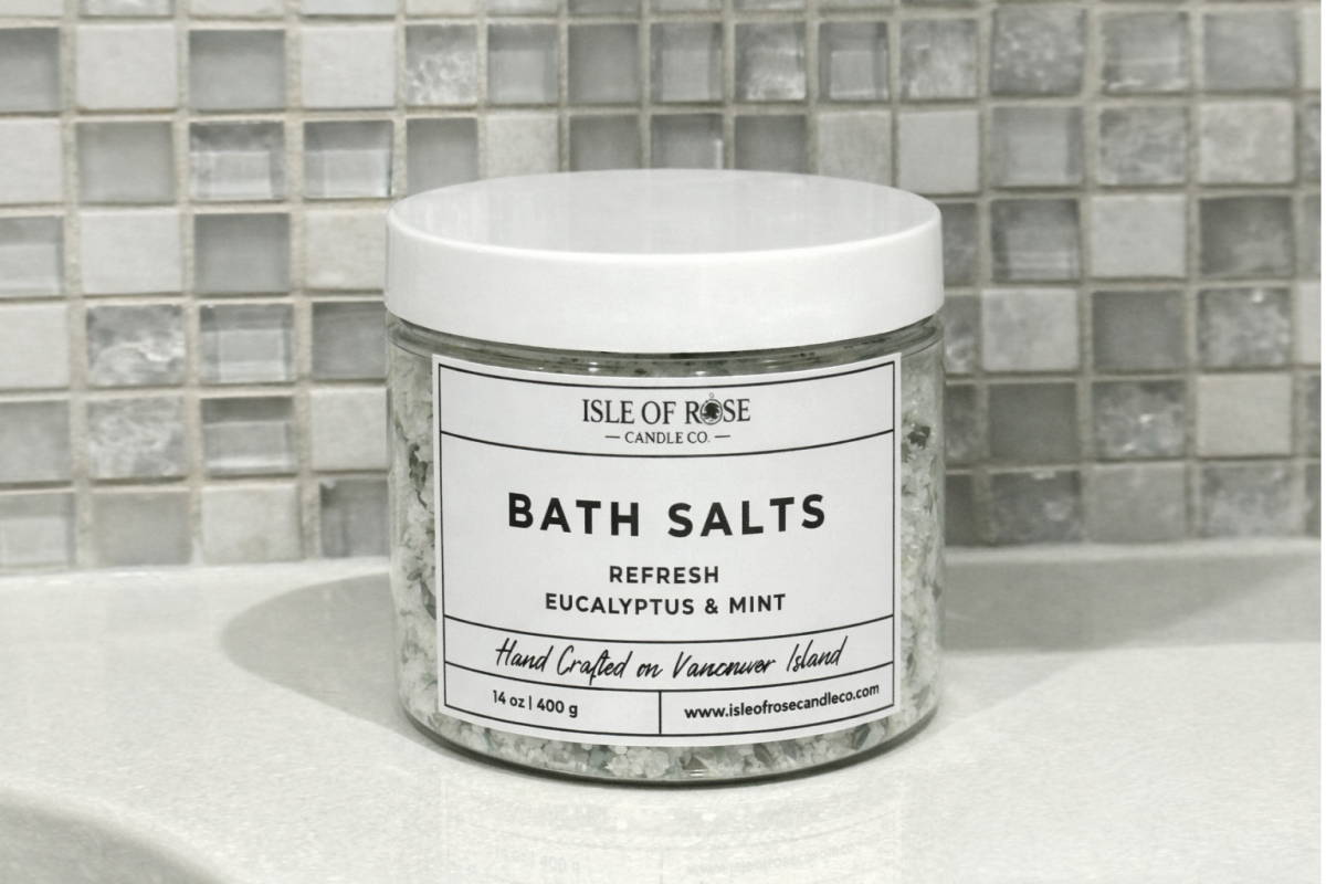 Jar of Isle of Rose Bath Salts on a bathroom counter with tiled wall background