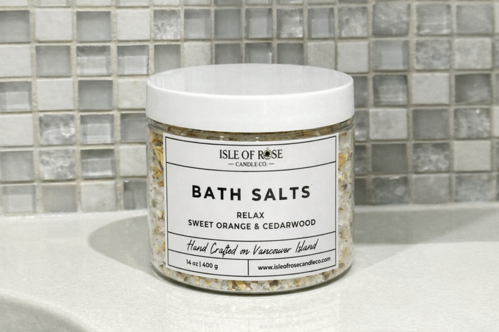 Jar of Isle of Rose Bath Salts on a bathroom counter with tiled wall background