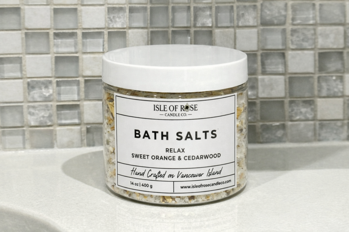 Jar of Isle of Rose Bath Salts on a bathroom counter with tiled wall background