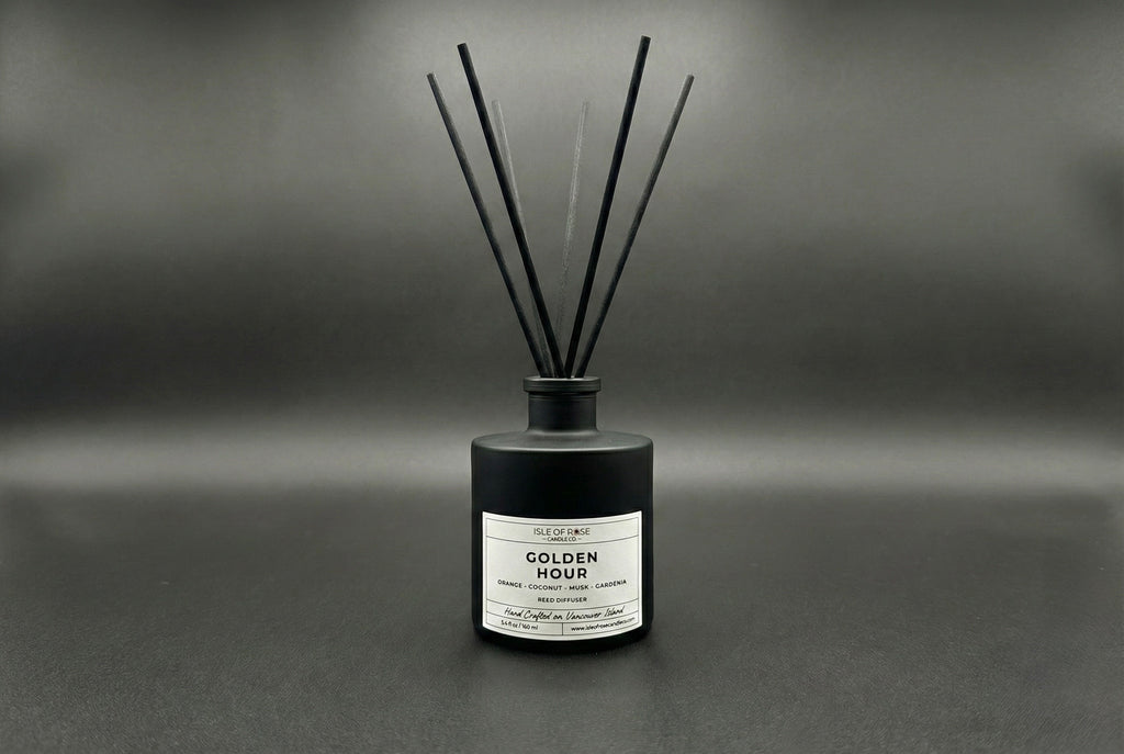 Black diffuser bottle labeled 'Golden Hour' on a gray background