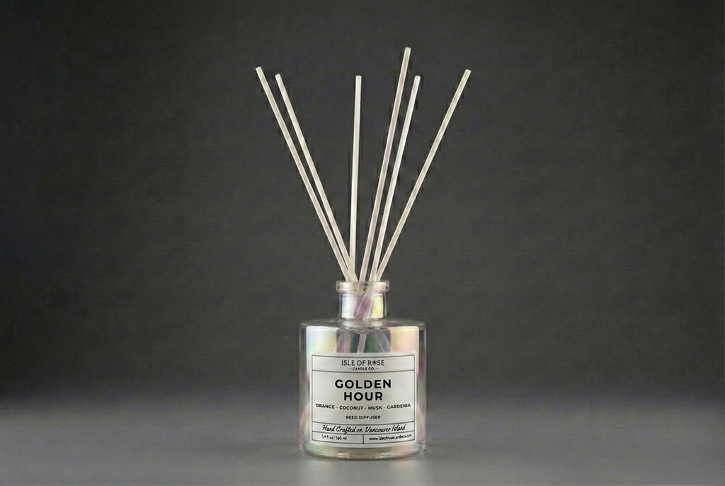 Diffuser with reeds labeled 'Golden Hour' on a dark background