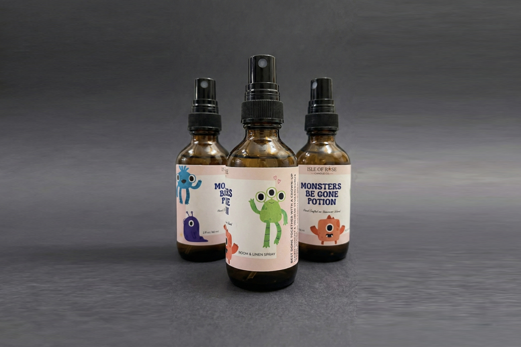 Three bottles of 'Monsters Be Gone Potion' on a gray background