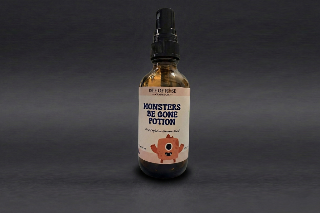 Bottle of 'Monsters Be Gone Potion' with a label on a dark background