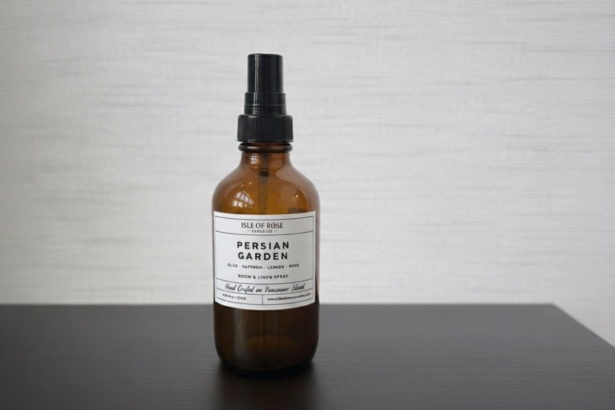Brown spray bottle labeled 'Persian Garden' on a gray surface with a light gray background