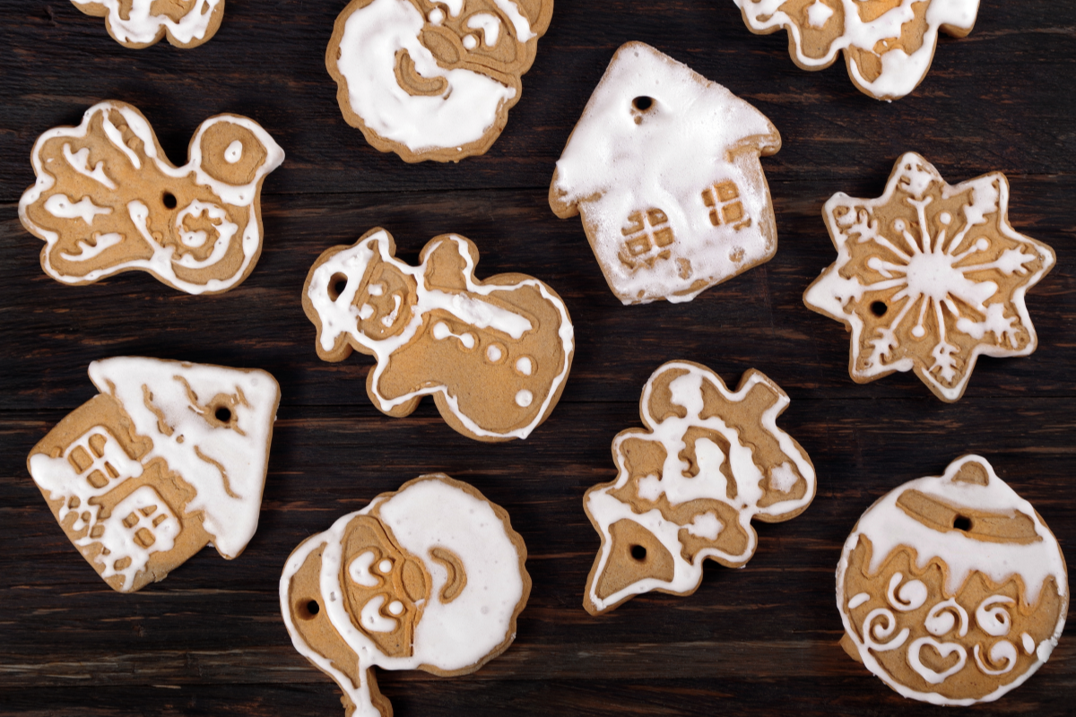 Decorative gingerbread cookies on a wooden surface