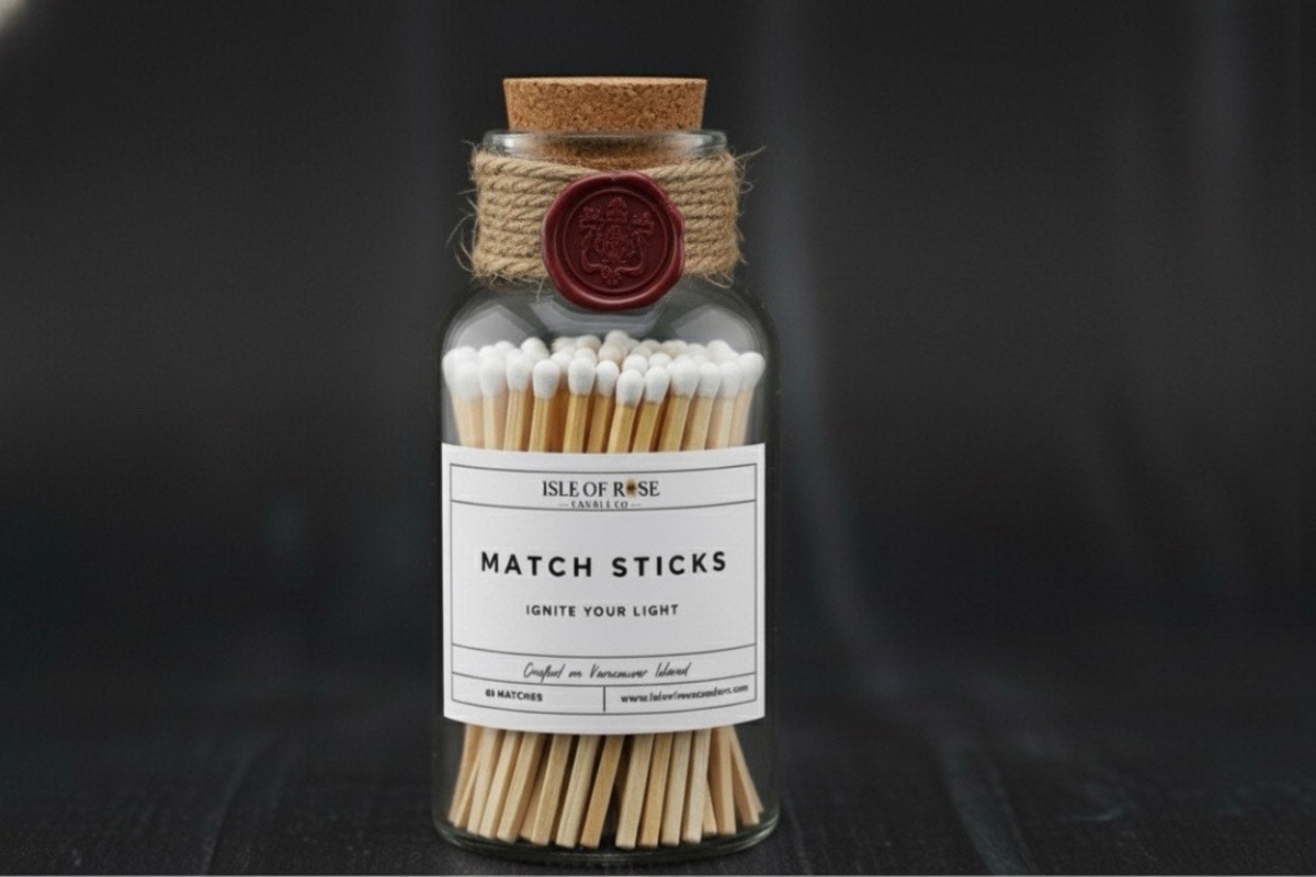 Jar of matchsticks with a label on a dark background